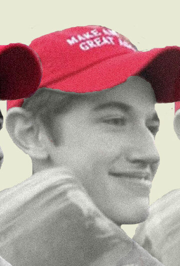 A photo of Nick Sandmann, a white teenager, wearing a Make America Great Again hat.