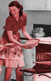 A 50s-style illustration of a woman and her child baking pie.