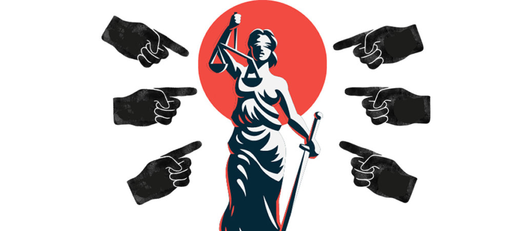 An illustration of hands pointing at a woman holding the weights of justice.