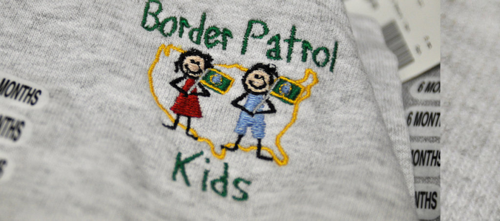 A photo of a shirt that says "Border Patrol Kids" on it.