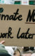 A photo from a climate change protest with the sign, "Climate Now, Homework later" that is visible.