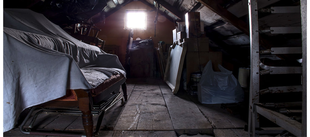 A photo of furniture in an attic or a basement.