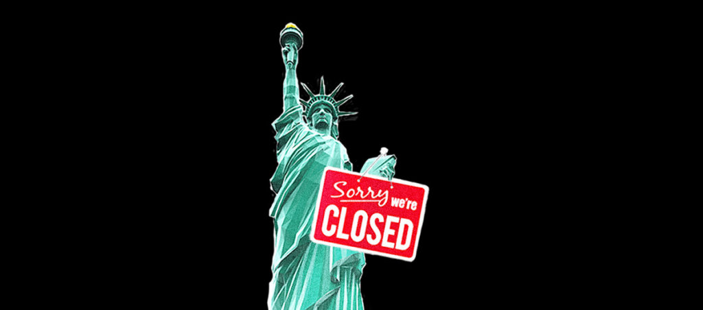 An image of the Statue of Liberty with a "Sorry, we're closed" sign on it.