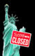 An image of the Statue of Liberty with a "Sorry, we're closed" sign on it.