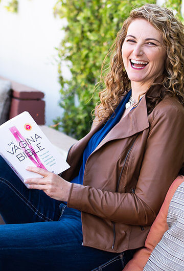 A photo of Dr Jen Gunter holding her book, "Vagina Bible"