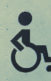 An icon of a person in a wheelchair