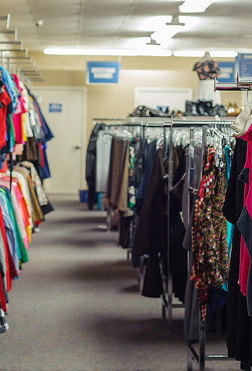 A photo of a thrift stories where colorful clothes are visible
