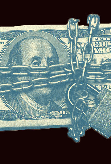 A stack of 100 dollar bills being locked up in chains.