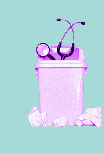 A pink stethoscope in a pink trash can.