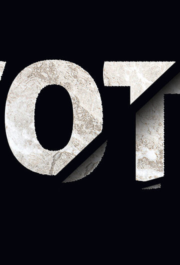 The word "Vote." The letters o, t, and e are slightly ripped up.