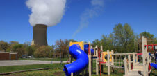 Children's playground in front of a power plant.