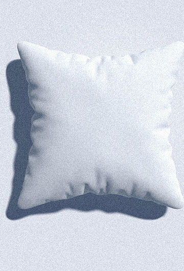 Three white pillows in a row on light blue background.