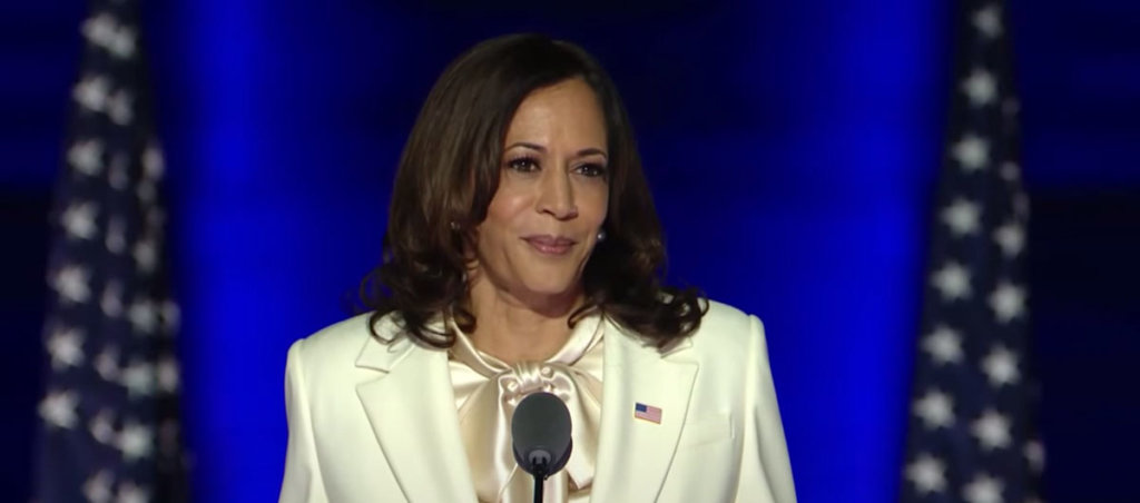 A photo of Kamala Harris in a white suit.