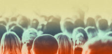 Crowd of people shot from behind so that only the tops of heads are visable