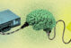 briefcase, brain and electrical outlet, with an electrical cord connecting all three to convey people always being plugged into work. the image is colorful, in hues of yellow, blue and green, with a slightly grainy texture look to it.