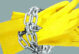 yellow cleaning gloves with chains around wrist part to convey human trafficking