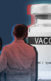 a woman and younger man standing in front of a covid vaccination vial