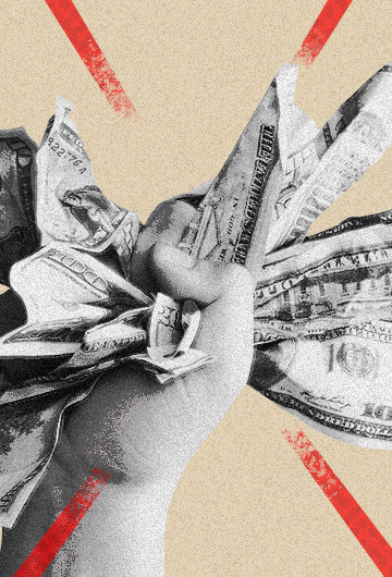 fist holding paper dollar bills