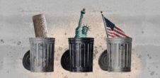 three garbage cans, one has the constitution in it, one has the statue of liberty and one has the american flag sticking out of it.