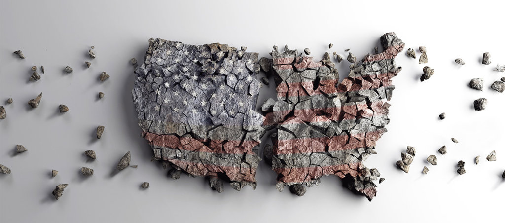 a sculpture of a map of the united states using concrete, it's split in two and is crumbling apart
