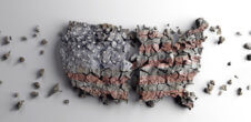 a sculpture of a map of the united states using concrete, it's split in two and is crumbling apart