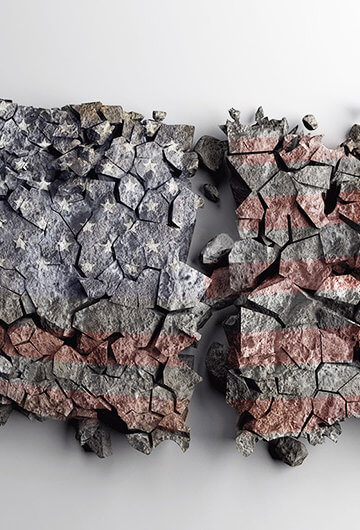 a sculpture of a map of the united states using concrete, it's split in two and is crumbling apart