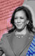 Vice President Kamala Harris. The background is a mix of newspaper pages