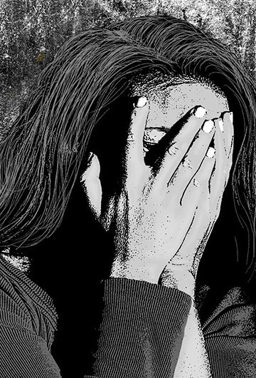 An illustration of a woman covering her hands with her face
