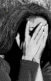 An illustration of a woman covering her hands with her face