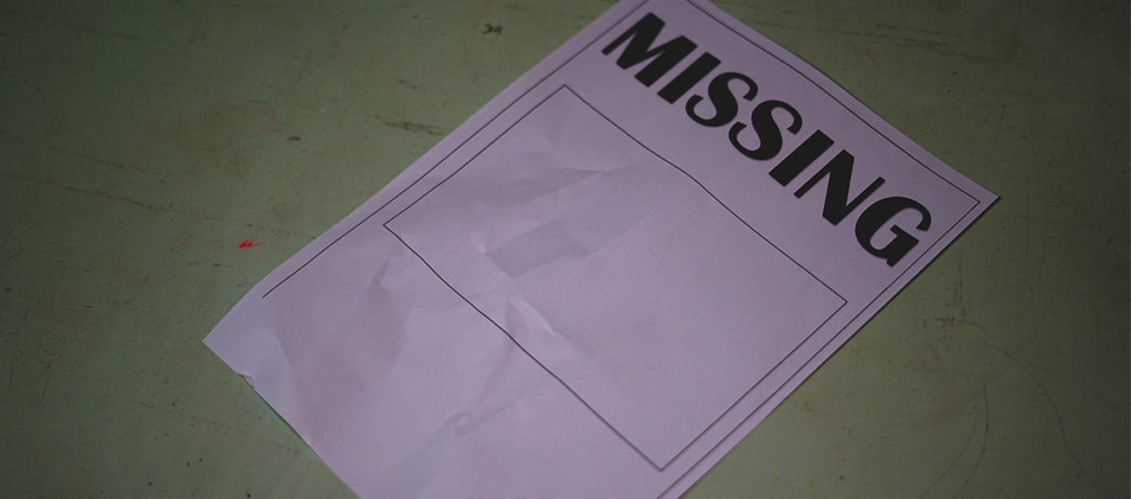 a missing persons poster on a greenish background.