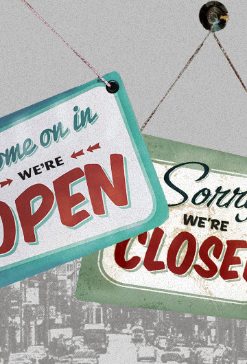 Jacksonville, North Carolina in the background in Black and white with signs in color that say "Come on in we're open" and "Sorry we're closed."