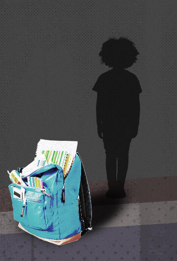 A silhouette of a kid in the background with a backpack stuffed with school supplies in the front