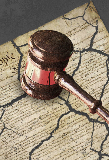 An illustration of a judge's hammer destroying the US Constitution.