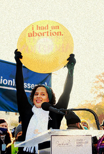 A photo of activist Bracey Sherman holding up a sign at a rally that says "I had an abortion." The sign she is holding is also to the right and left of the main image.
