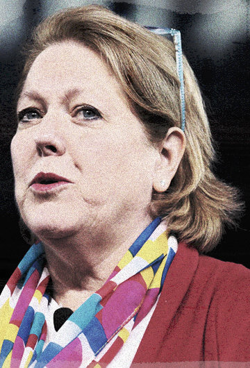 Ginni Thomas looking sideways at the camera with glasses perched on her head, a white woman, wife of Supreme Court Justice Clarence Thoman