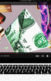 A collage of a laptop and within it is a YouTube video with MLM items in it.