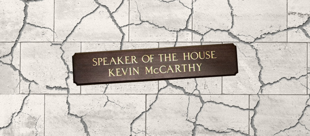 The speaker of the house sign on a grey crackled background. the sign itself reads speaker of the house kevin mccarthy.
