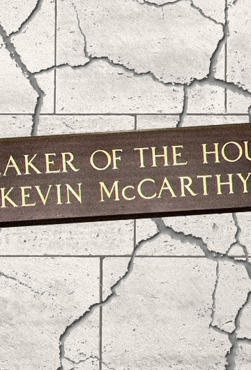 The speaker of the house sign on a grey crackled background. the sign itself reads speaker of the house kevin mccarthy.