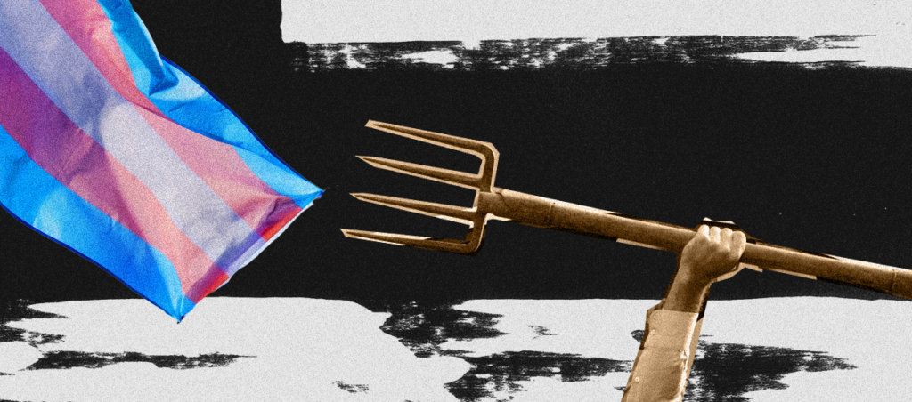 A man's arm holding a pitchfork in the direction of a trans flag.