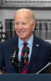 An image of President Joe Biden standing behind a podium at the White House