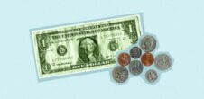 An image of a dollar bill with some coins next to it.